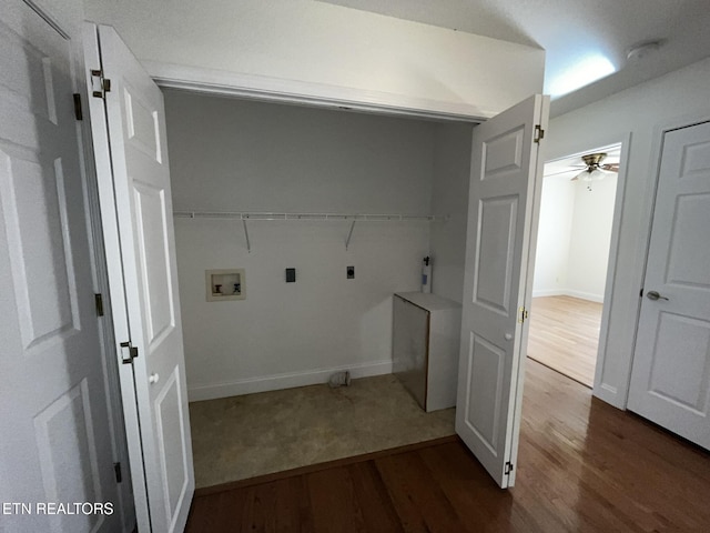 laundry room featuring dark wood-style flooring, hookup for a washing machine, hookup for an electric dryer, laundry area, and baseboards