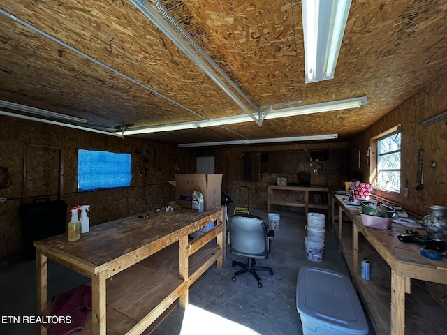 interior space featuring concrete floors and a workshop area