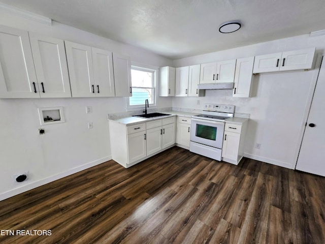 kitchen featuring light countertops, white cabinets, white electric range, and a sink