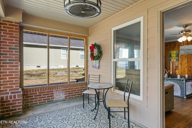 sunroom / solarium with ceiling fan