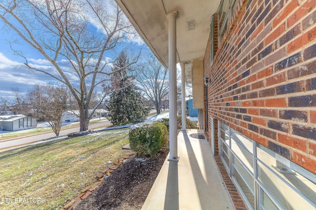 exterior space with brick siding