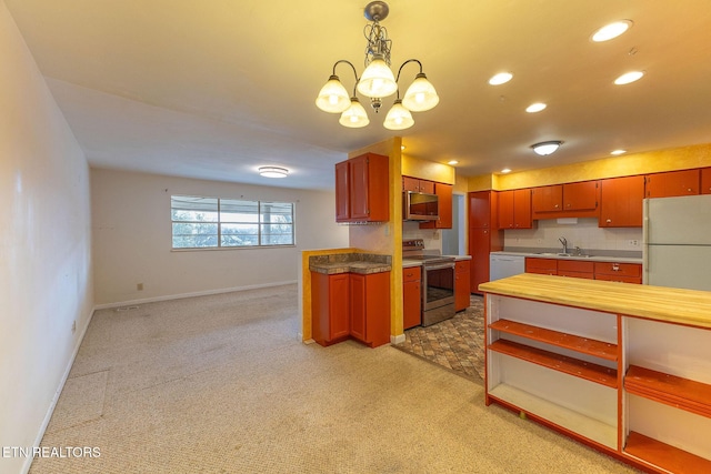 kitchen featuring decorative light fixtures, light carpet, stainless steel range with electric cooktop, a sink, and white dishwasher