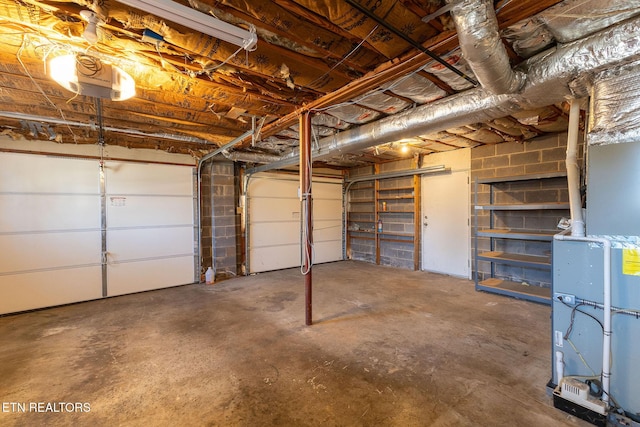 garage featuring concrete block wall