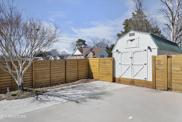 exterior space with fence, an outdoor structure, and a shed