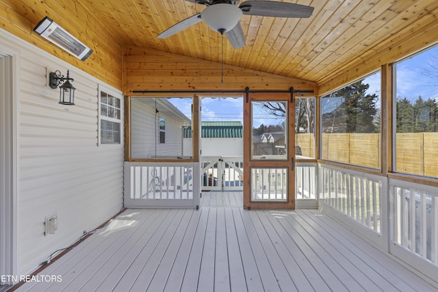 unfurnished sunroom with wooden ceiling, ceiling fan, and vaulted ceiling