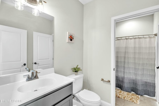 bathroom featuring toilet, tile patterned flooring, a shower with shower curtain, and vanity