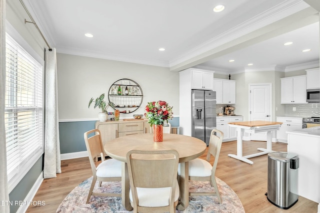 dining space with recessed lighting, light wood-type flooring, and crown molding