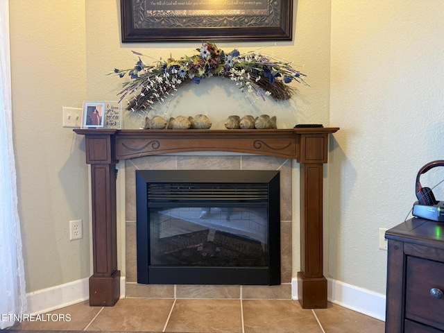 room details featuring a fireplace and baseboards