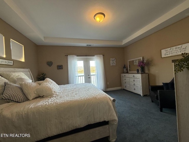 bedroom with a tray ceiling, french doors, carpet, access to outside, and baseboards