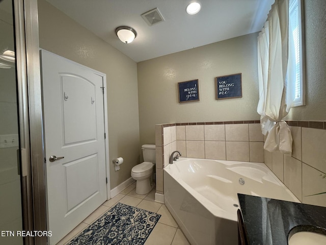 full bath featuring visible vents, toilet, vanity, tile patterned flooring, and a bath