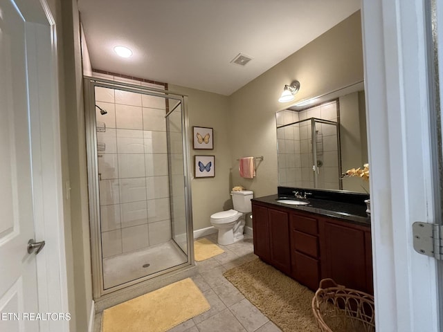 bathroom featuring a stall shower, visible vents, toilet, tile patterned flooring, and vanity