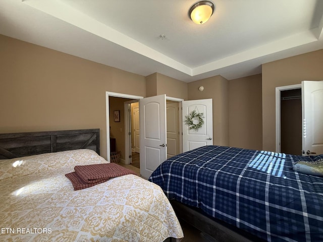 bedroom featuring a raised ceiling