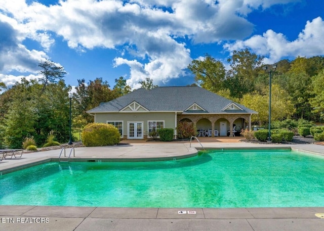 community pool featuring a patio area and french doors