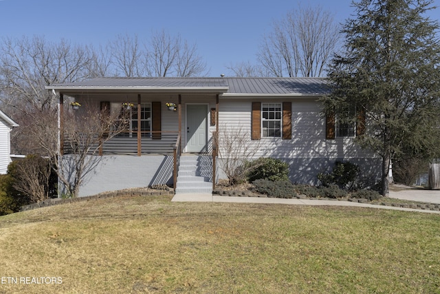 ranch-style house with a front lawn, covered porch, and metal roof