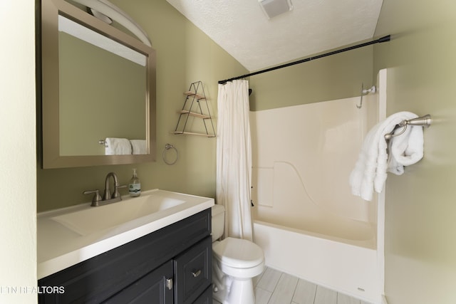 full bathroom featuring visible vents, toilet, vanity, shower / tub combo, and a textured ceiling