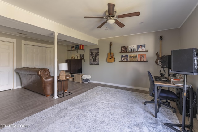 office with visible vents, ceiling fan, baseboards, and wood finished floors