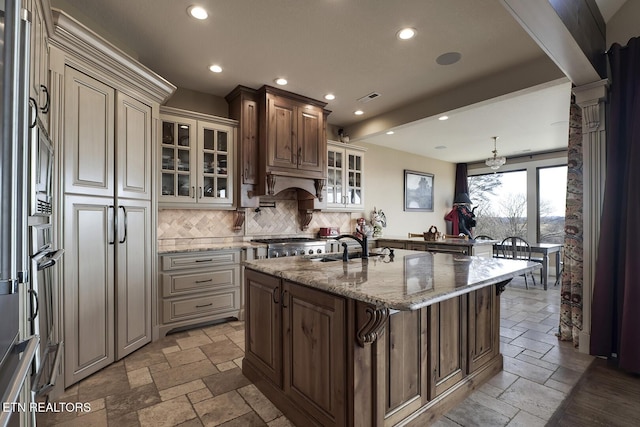 245 Harrison Bend Rd, Loudon, TN 37774 - kitchen featuring stone tile floors, decorative backsplash, and light stone counters