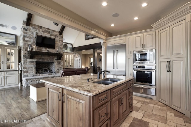 245 Harrison Bend Rd, Loudon, TN 37774 - kitchen with built in appliances, open floor plan, an island with sink, a warming drawer, and a sink