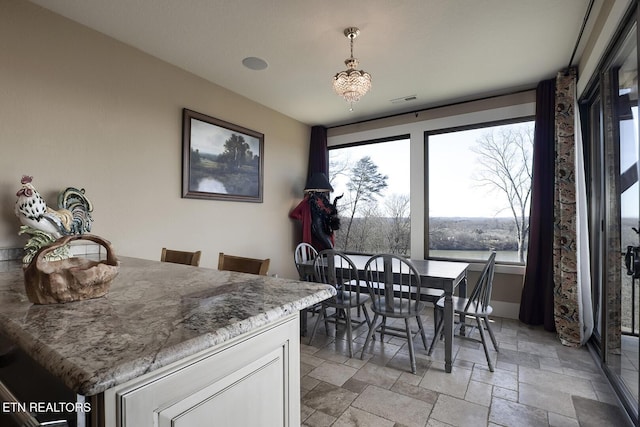 245 Harrison Bend Rd, Loudon, TN 37774 - dining space with visible vents and stone tile flooring