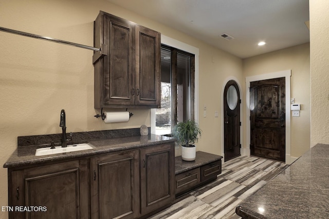 245 Harrison Bend Rd, Loudon, TN 37774 - kitchen with dark brown cabinetry, recessed lighting, visible vents, and a sink