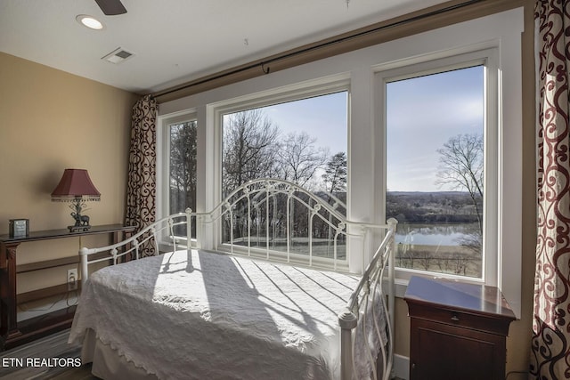 245 Harrison Bend Rd, Loudon, TN 37774 - bedroom featuring visible vents, recessed lighting, and a water view