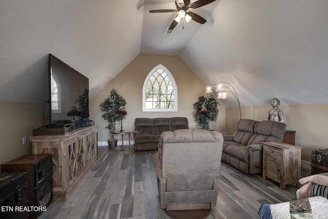 245 Harrison Bend Rd, Loudon, TN 37774 - living area with ceiling fan with notable chandelier, baseboards, lofted ceiling, and wood finished floors