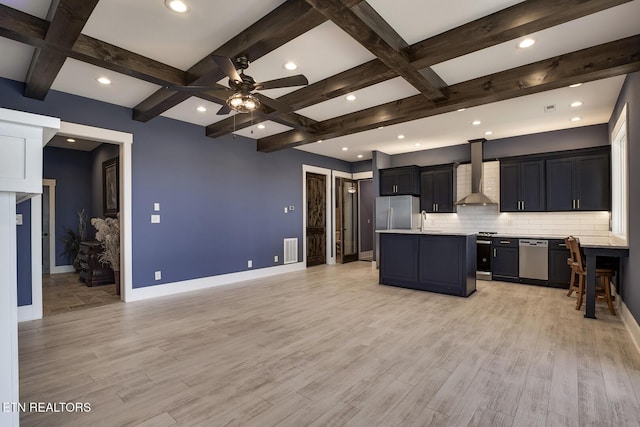 245 Harrison Bend Rd, Loudon, TN 37774 - kitchen with a sink, light countertops, appliances with stainless steel finishes, wall chimney exhaust hood, and open floor plan