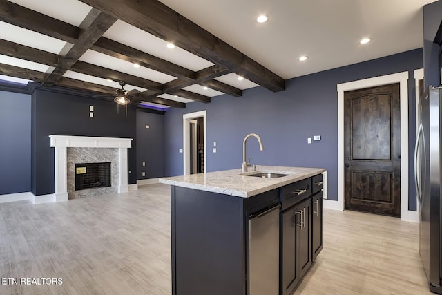 245 Harrison Bend Rd, Loudon, TN 37774 - kitchen featuring a center island with sink, freestanding refrigerator, ceiling fan, a sink, and light wood-type flooring