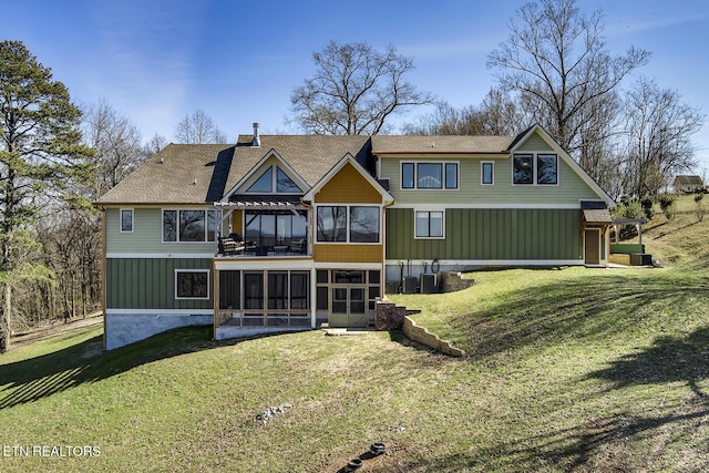 245 Harrison Bend Rd, Loudon, TN 37774 - rear view of house with central AC, a lawn, and a sunroom