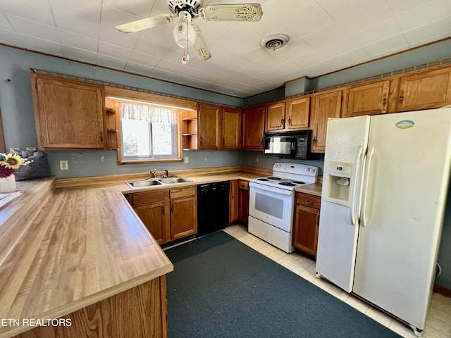 kitchen featuring visible vents, light countertops, black appliances, open shelves, and a sink