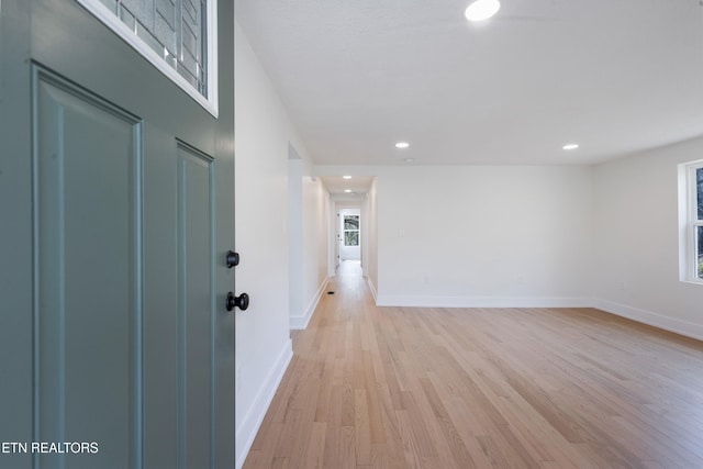 interior space with recessed lighting, light wood-style floors, and baseboards