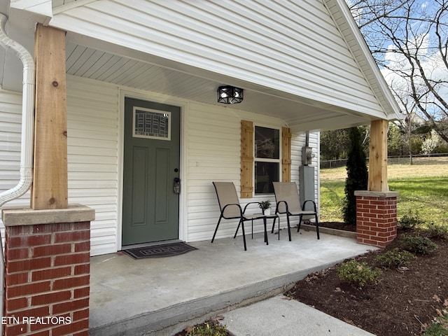 doorway to property featuring covered porch