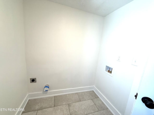 clothes washing area with laundry area, hookup for an electric dryer, baseboards, and washer hookup