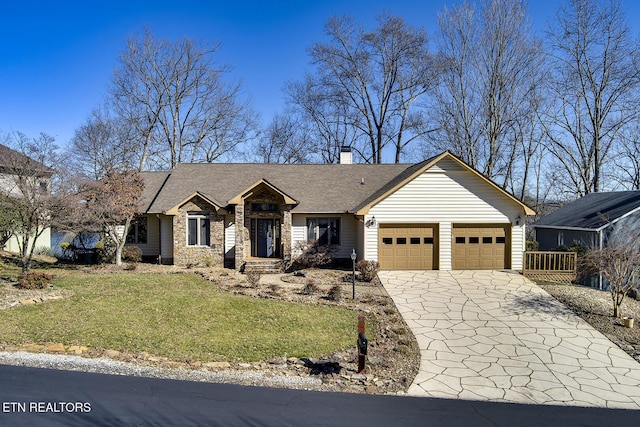 view of front of home with a garage, concrete driveway, stone siding, a chimney, and a front lawn