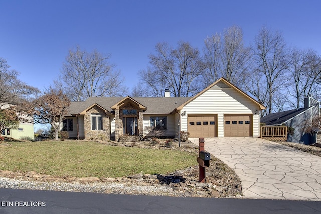 view of front of house with concrete driveway, stone siding, a chimney, an attached garage, and a front yard