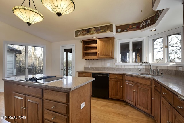 kitchen with brown cabinetry, light wood-style flooring, black appliances, open shelves, and a sink