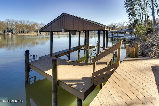 view of dock featuring a water view and boat lift