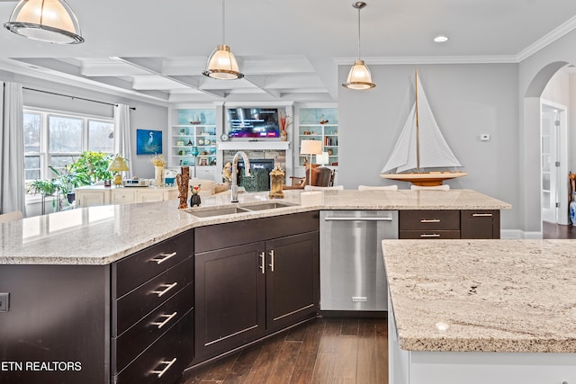 kitchen with arched walkways, open floor plan, a sink, coffered ceiling, and dishwasher