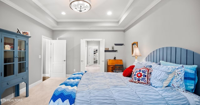 bedroom featuring a tray ceiling, crown molding, recessed lighting, carpet flooring, and baseboards