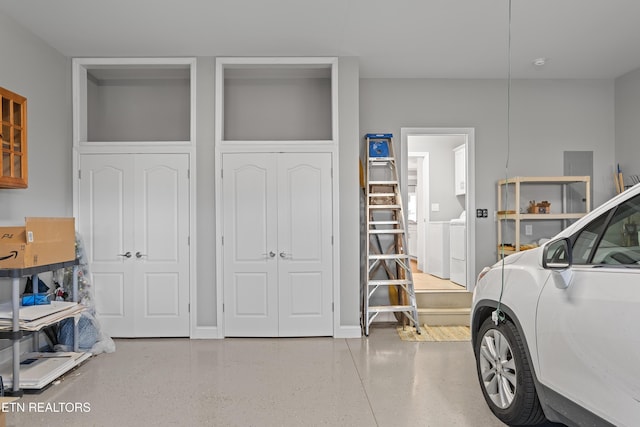 garage with washing machine and dryer