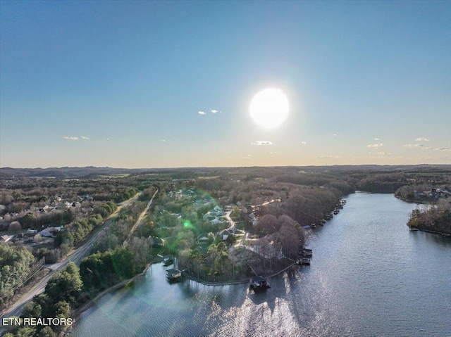 aerial view at dusk with a water view