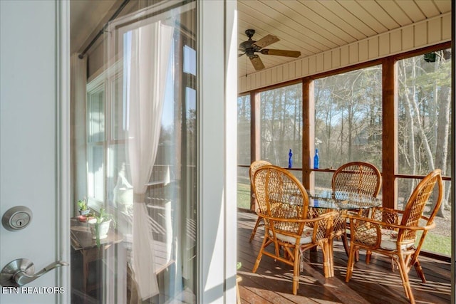 sunroom / solarium with wooden ceiling and ceiling fan