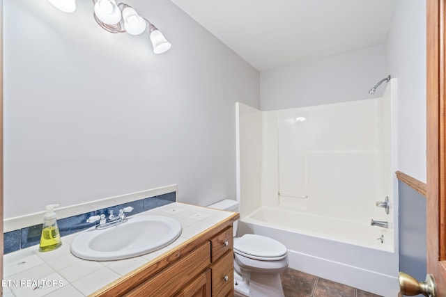 full bath featuring tub / shower combination, vanity, and toilet