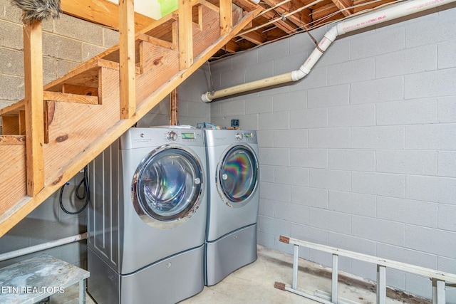 clothes washing area featuring laundry area and washer and dryer