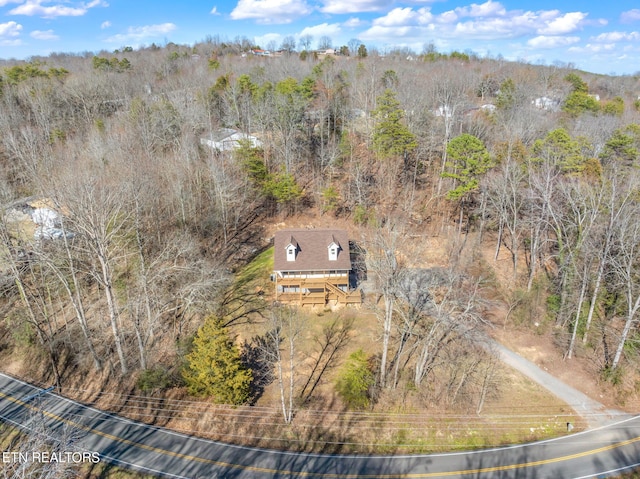 aerial view with a wooded view