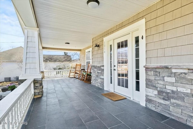 view of patio featuring a porch