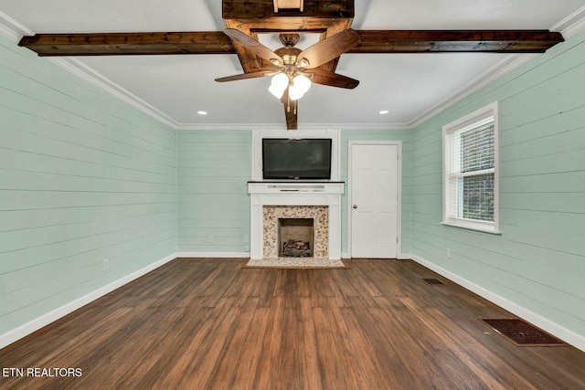 unfurnished living room featuring visible vents, a fireplace, crown molding, and dark wood-style flooring