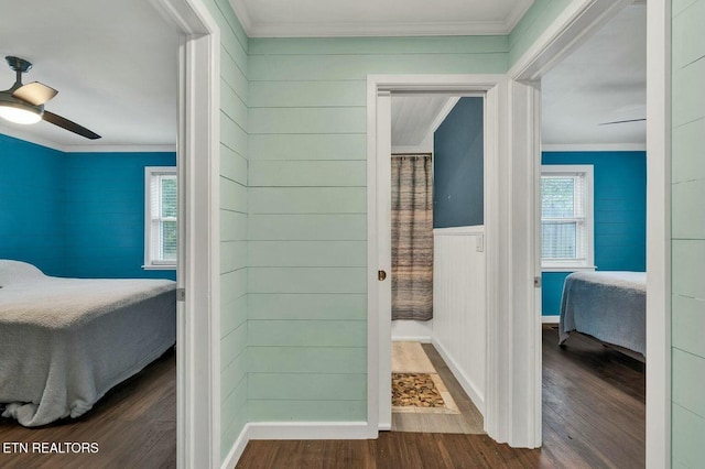 interior space featuring crown molding and wood finished floors