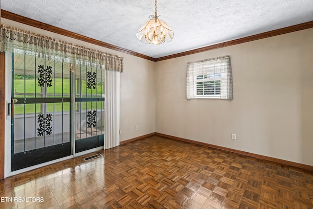 unfurnished room featuring baseboards, visible vents, a chandelier, and a textured ceiling