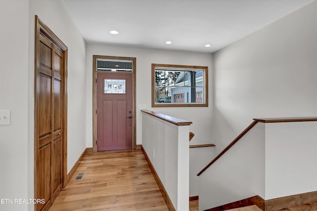 foyer featuring visible vents, recessed lighting, light wood-style flooring, and baseboards